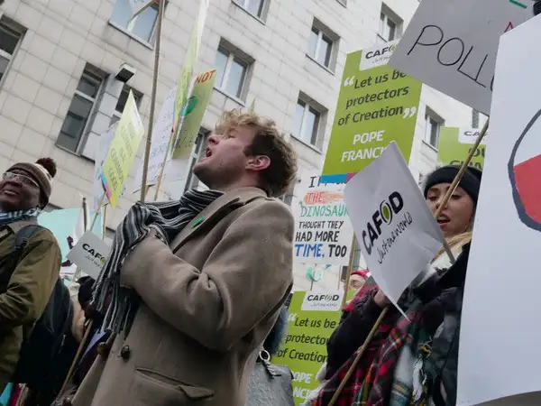 Europe - Poland - CAFOD campaigner leads chant at COP24 rally