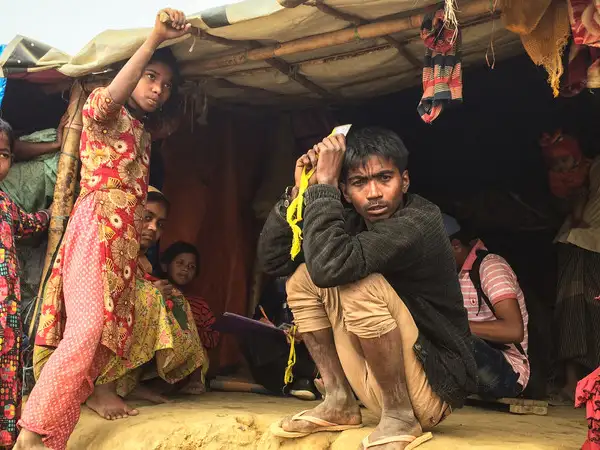 Asia - Bangladesh - Rohingya camp - man and children in poor housing