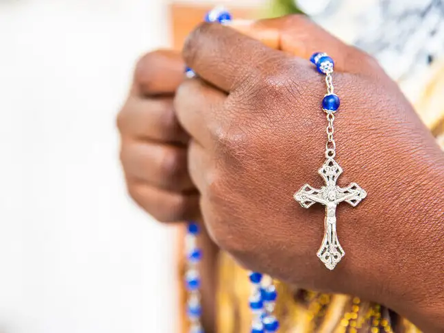 Hands clasped in prayer