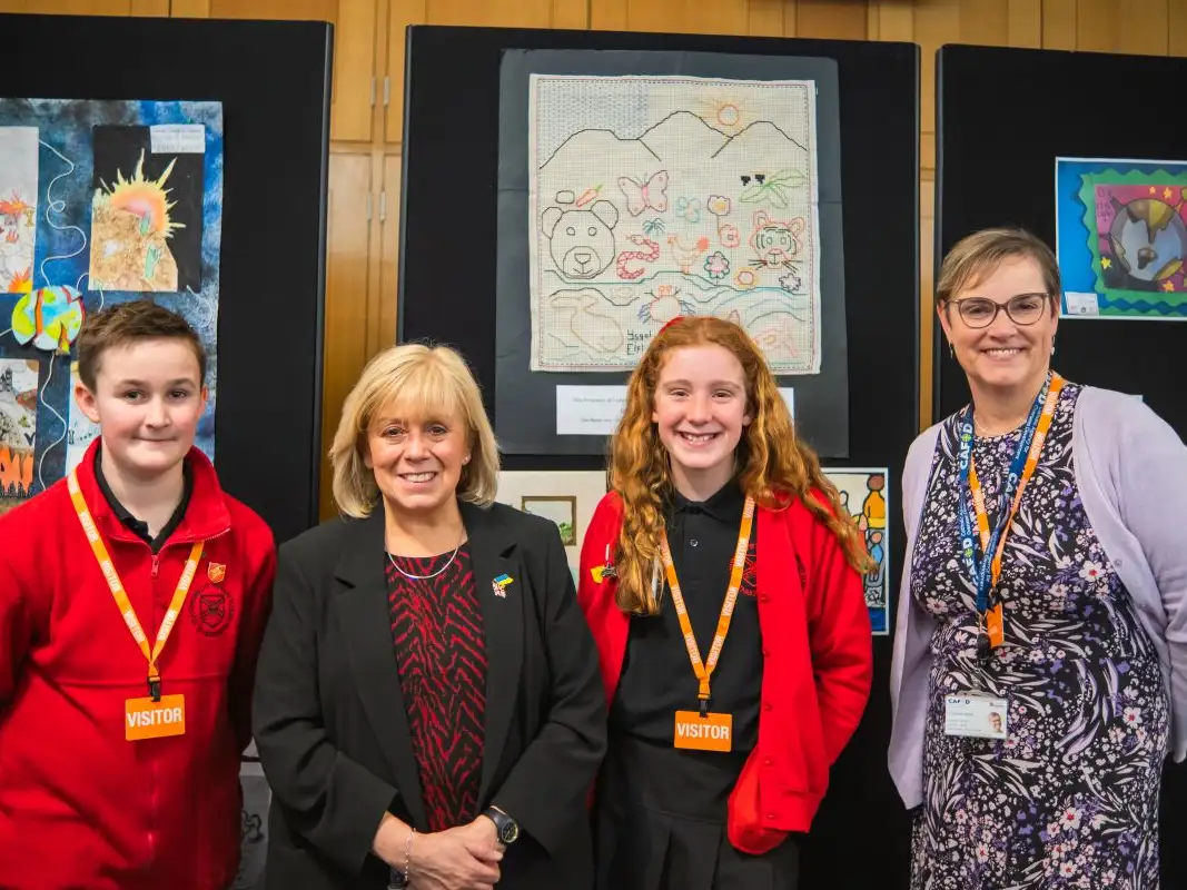 Young climate justice campaigners share their message with MPs at art exhibition in Parliament